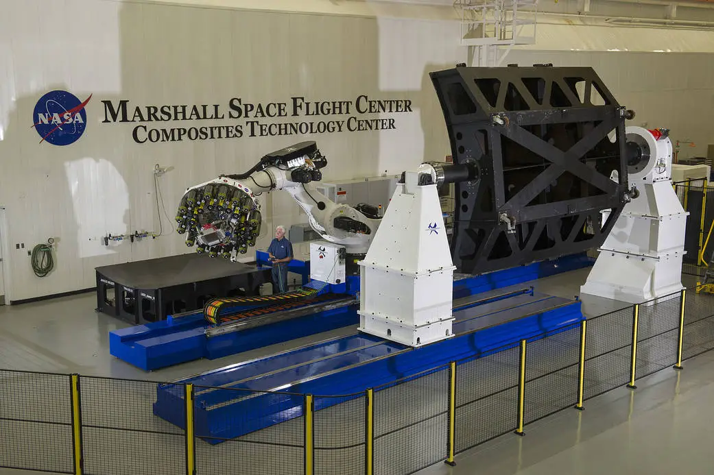 NASA automated fiber placement robot preparing large composite rocket components